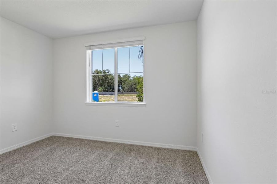 Spacious, unfurnished interior of a new home in The Grove at Stuart Crossing - Signature Series, Bartow (Image 23).