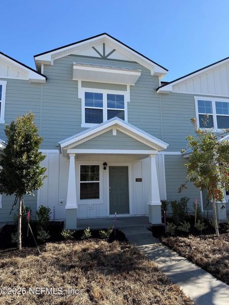 Front exterior of a new home in Liberty Cove, Yulee, FL, highlighting curb appeal (Image 18).