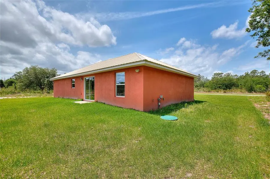 Exterior details and patio area of a home in , Indian Lake Estates (Image 4).