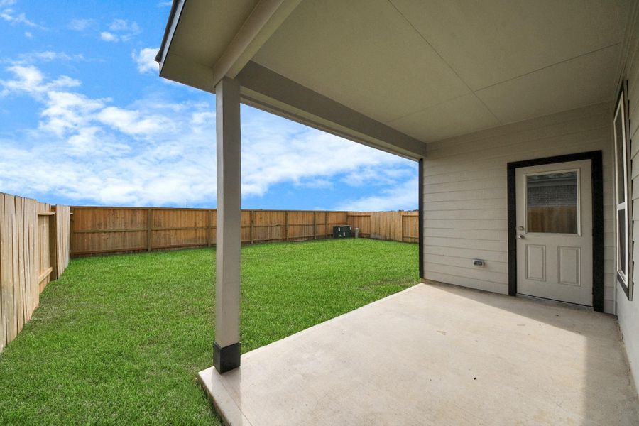 Experience outdoor living at its finest on this expansive covered patio, thoughtfully designed for BBQs and delightful outdoor dining.