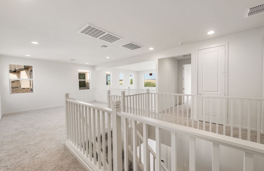 Spacious, unfurnished interior of a new home in Legado West, Queen Creek (Image 29).