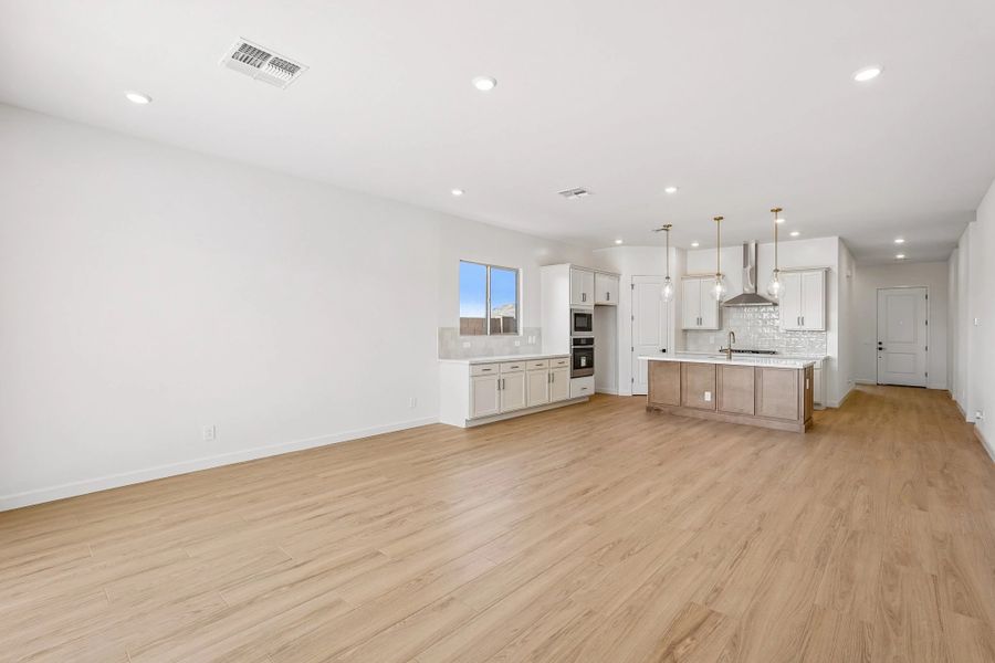 Great room, dining and kitchen Great room, dining and kitchen