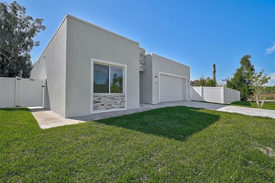 Exterior details and patio area of a home in , North Port (Image 28).