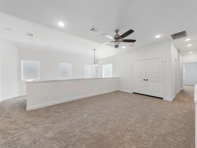 The Upstairs Game Room is conveniently located between the Primary Bedroom and the 3 Secondary bedrooms. (Sample photos of a completed Warwick floor plan. The image may feature alternative selections and/or upgrades.)