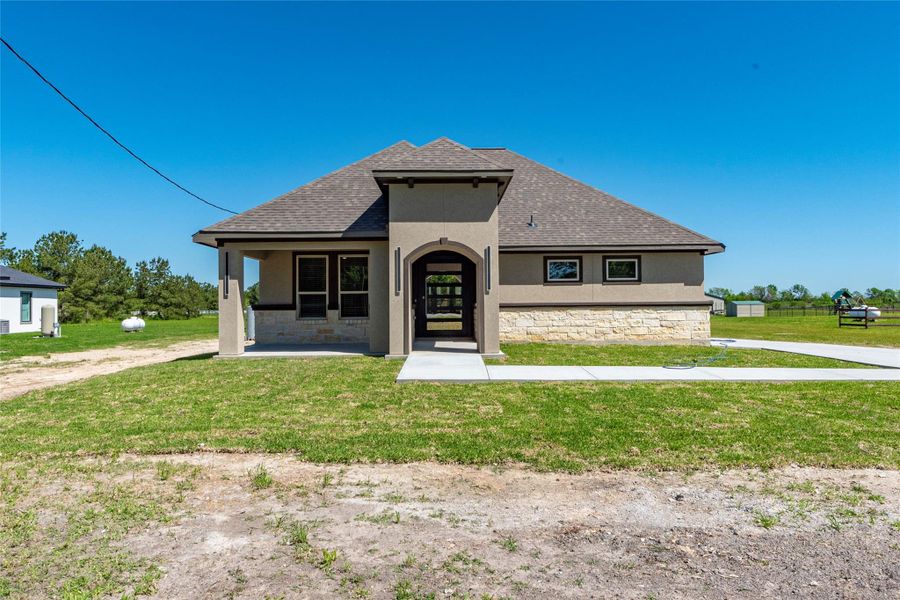 Front exterior of a new home in , Dayton, TX, highlighting curb appeal (Image 22). Front exterior of a new home in , Dayton, TX, highlighting curb appeal (Image 22).