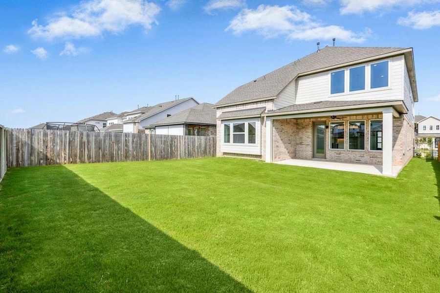 Front exterior of a new home in Santa Rita Ranch, Liberty Hill, TX, highlighting curb appeal (Image 2). Front exterior of a new home in Santa Rita Ranch, Liberty Hill, TX, highlighting curb appeal (Image 2).