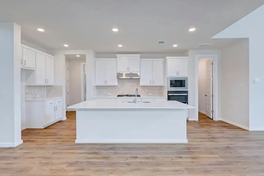 Representative furnished interior of a home built from the Travis by Scott Felder Homes in Flora, Hutto (Image 3).