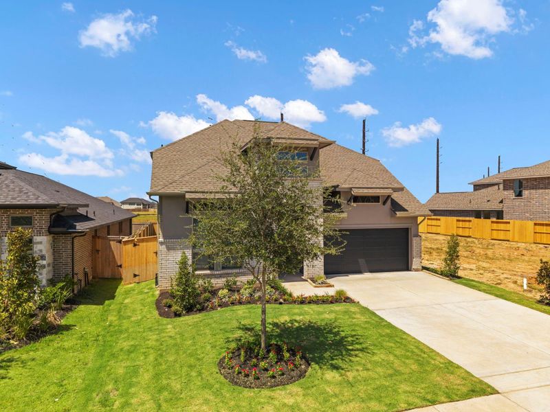 Front exterior of a new home in Candela, Richmond, TX, highlighting curb appeal (Image 24).