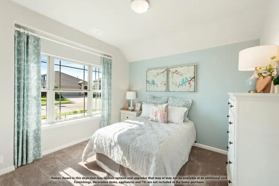 Bedroom with vaulted ceiling, light blue walls, carpet flooring, and large window with teal curtains