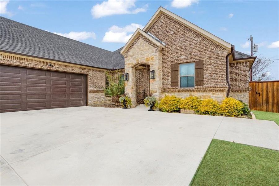 Front exterior of a new home in , Sherman, TX, highlighting curb appeal (Image 22). Front exterior of a new home in , Sherman, TX, highlighting curb appeal (Image 22).