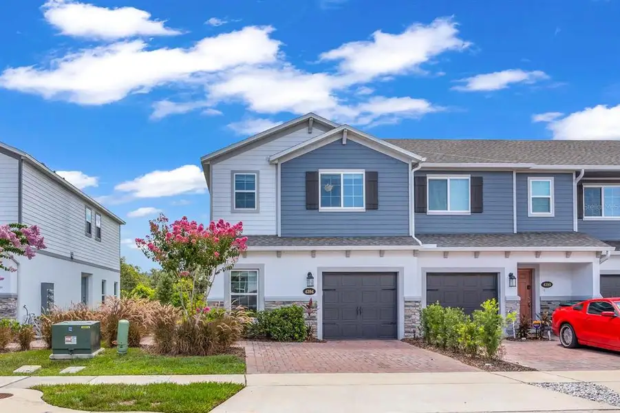 Front exterior of a new home in , Orlando, FL, highlighting curb appeal (Image 23).