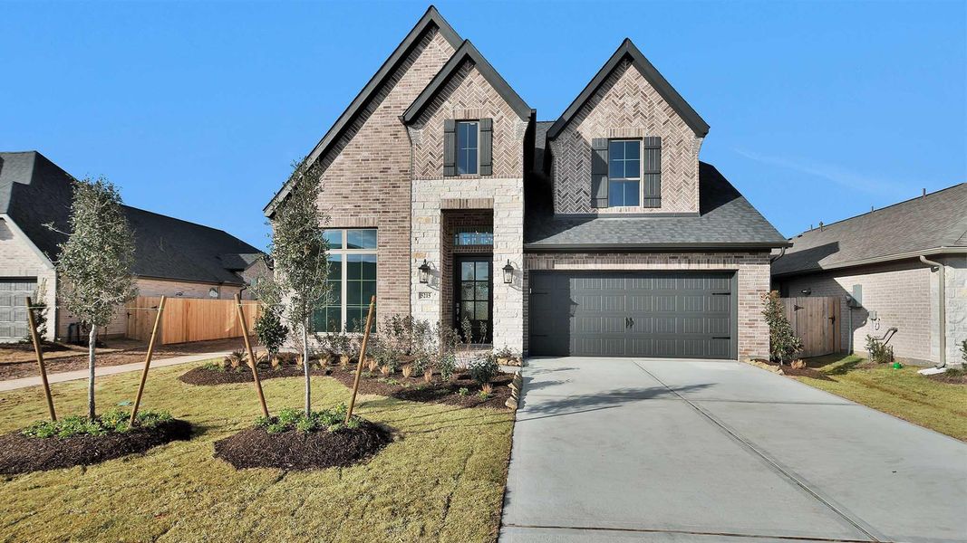 Front exterior of a new home in StoneCreek Estates, Richmond, TX, highlighting curb appeal (Image 2).