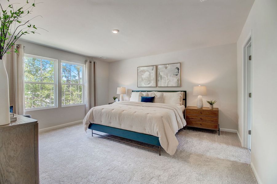 A bedroom with a large bed.