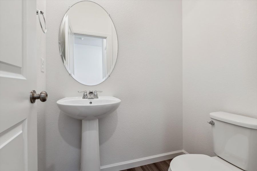 A bathroom with a sink and toilet.