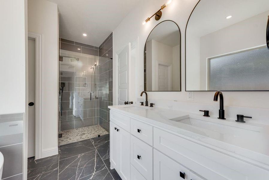 Owner's Bathroom with vanity and an enclosed shower