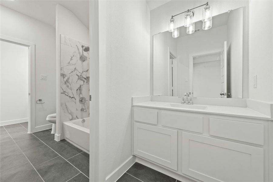 Furnished interior view inside a new home in Sunterra, Katy (Image 9).