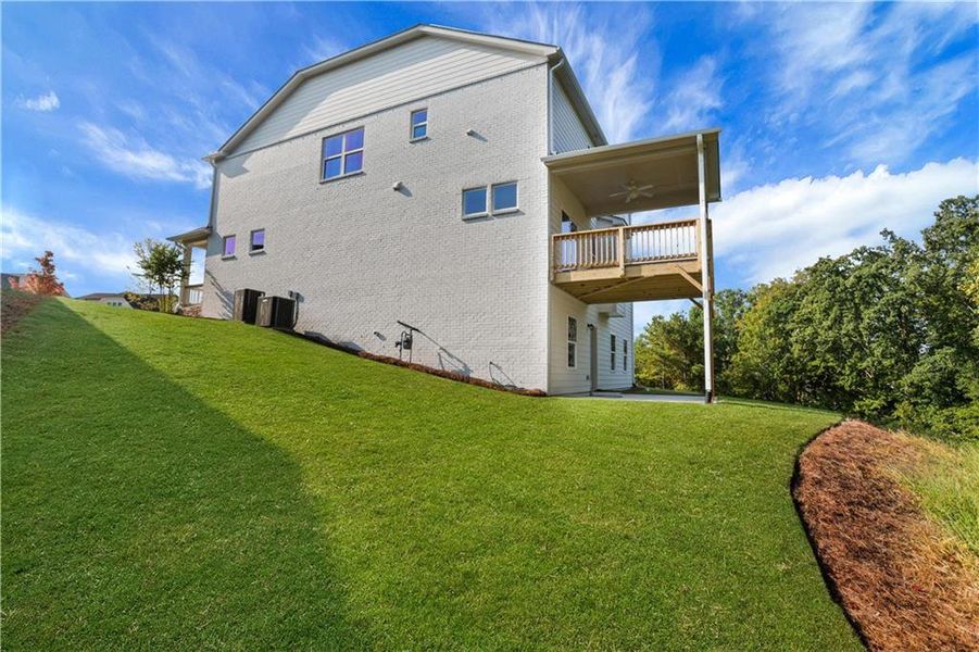 Front exterior of a new home in Cambridge, Flowery Branch, GA, highlighting curb appeal (Image 24). Front exterior of a new home in Cambridge, Flowery Branch, GA, highlighting curb appeal (Image 24).