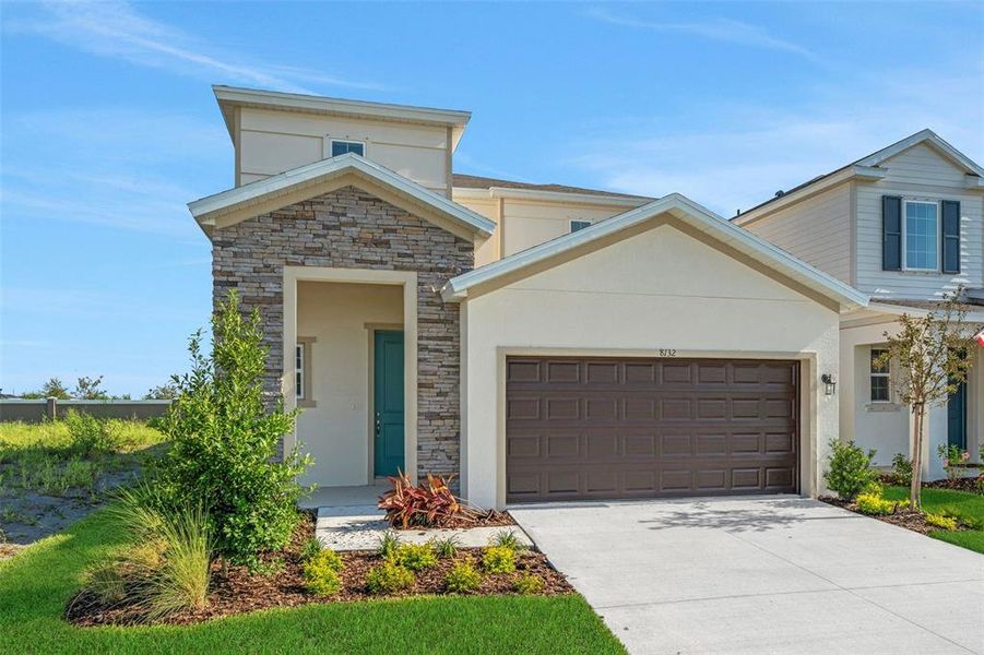 Front exterior of a new home in Seaire, Parrish, FL, highlighting curb appeal (Image 2). Front exterior of a new home in Seaire, Parrish, FL, highlighting curb appeal (Image 2).