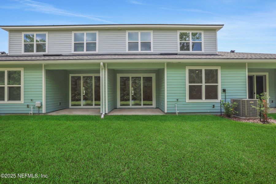 Front exterior of a new home in The Hammock at Palm Harbor, Palm Coast, FL, highlighting curb appeal (Image 19).