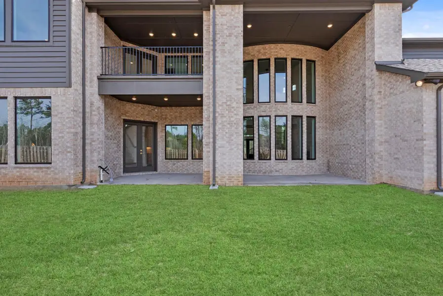 view of back of the house capturing the vastness and size of the ceiling heights