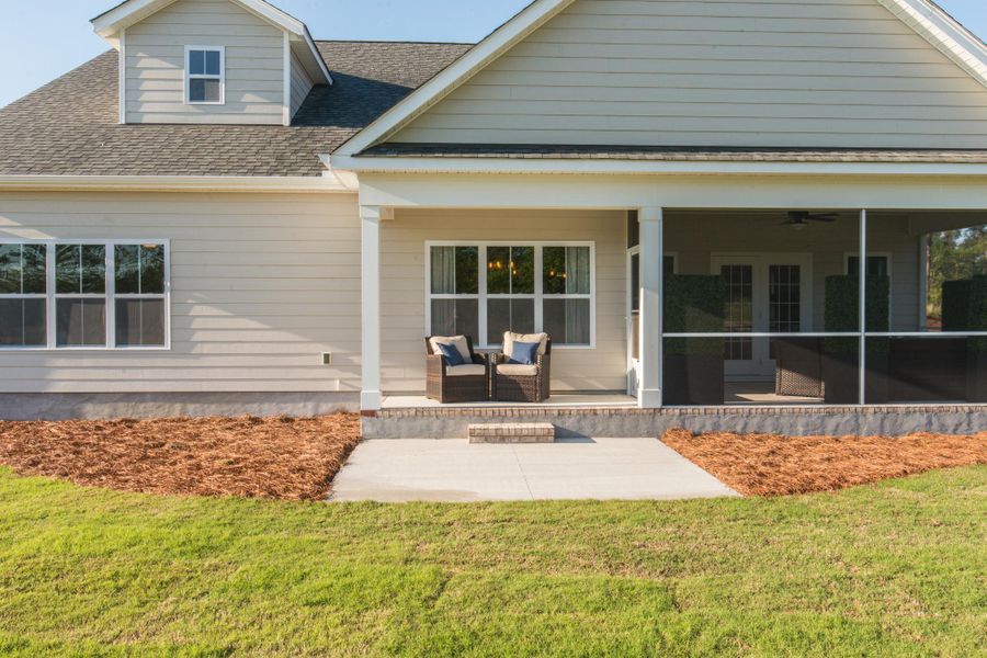 Representative exterior photo of a completed home built from the Helmsley by Bill Clark Homes in The Sanctuary at Sunset Beach, Sunset Beach, NC (Image 27). Representative exterior photo of a completed home built from the Helmsley by Bill Clark Homes in The Sanctuary at Sunset Beach, Sunset Beach, NC (Image 27).