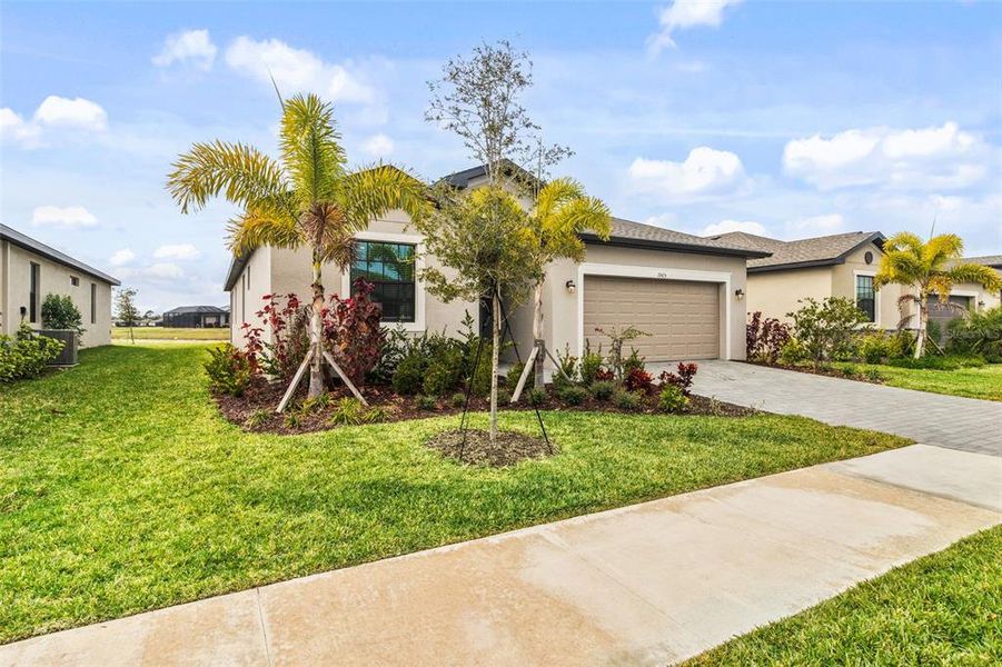 Front exterior of a new home in , Port Charlotte, FL, highlighting curb appeal (Image 26). Front exterior of a new home in , Port Charlotte, FL, highlighting curb appeal (Image 26).