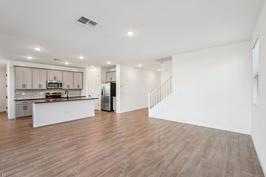 Great room and kitchen. Finishes and options may vary.