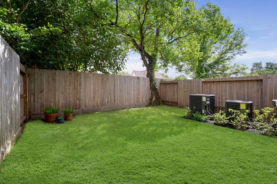A private, fully fenced yard with real grass and room to breathe — a genuinely usable outdoor space in the heart of the inner loop. A private, fully fenced yard with real grass and room to breathe — a genuinely usable outdoor space in the heart of the inner loop.