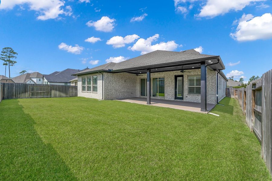 Front exterior of a new home in The Meadows at Imperial Oaks, Conroe, TX, highlighting curb appeal (Image 19). Front exterior of a new home in The Meadows at Imperial Oaks, Conroe, TX, highlighting curb appeal (Image 19).