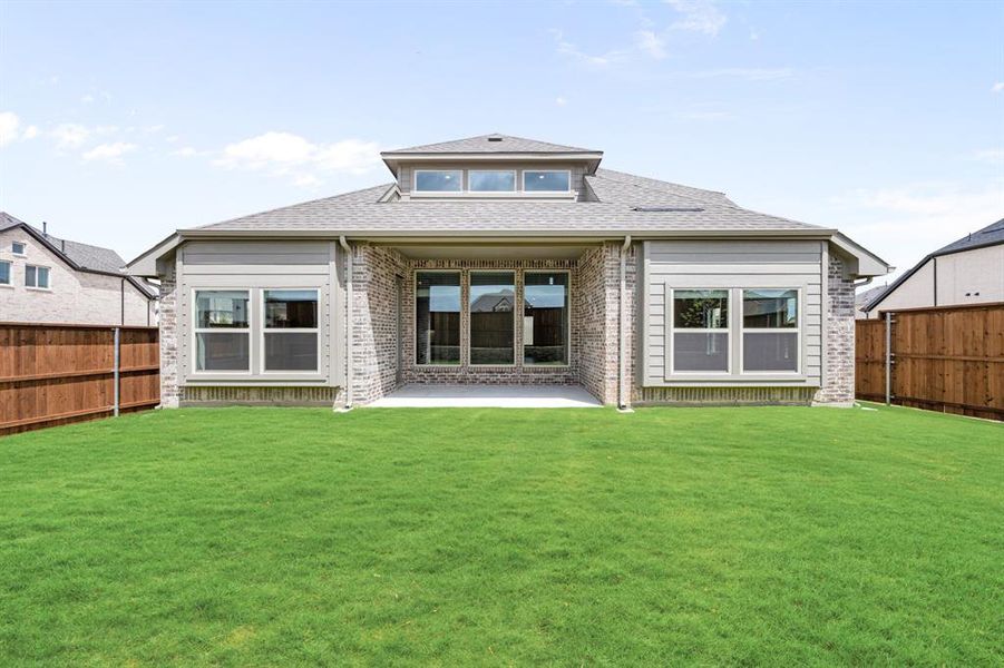 Exterior details and patio area of a home in Creekview Meadows, Pilot Point (Image 26).