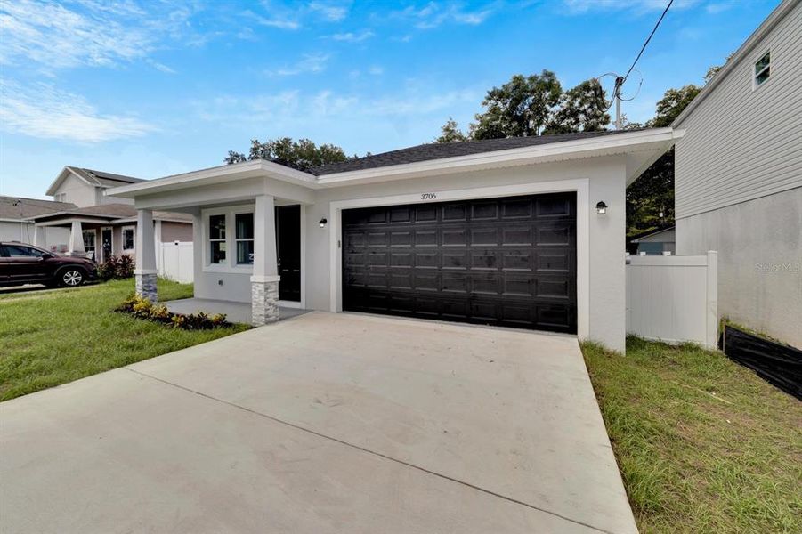 Front exterior of a new home in , Tampa, FL, highlighting curb appeal (Image 27).