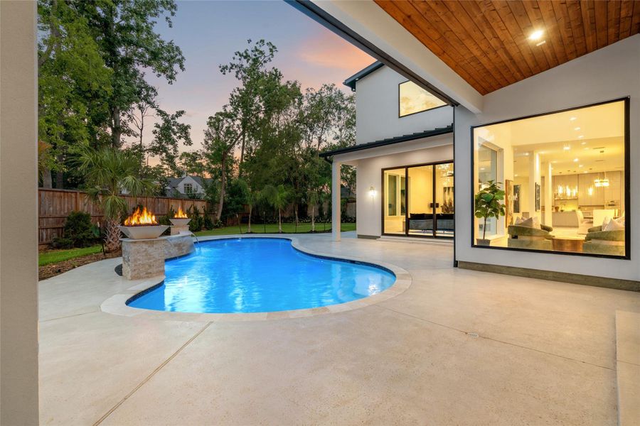 The stunning pool has been recently redesigned to showcase three cascading waterfalls, flanked by dual fire pits—creating a dramatic and luxurious outdoor focal point. The stunning pool has been recently redesigned to showcase three cascading waterfalls, flanked by dual fire pits—creating a dramatic and luxurious outdoor focal point.