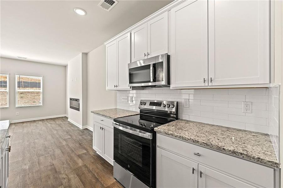 Furnished interior view inside a new home in The Grove At Mundy Mill, Gainesville (Image 8). Furnished interior view inside a new home in The Grove At Mundy Mill, Gainesville (Image 8).