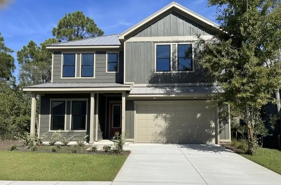 Front exterior of a new home in The Shoal, Santa Rosa Beach, FL, highlighting curb appeal (Image 1). Front exterior of a new home in The Shoal, Santa Rosa Beach, FL, highlighting curb appeal (Image 1).