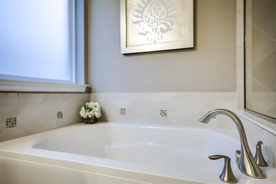 Modern owner's bath with dual vanities and a spacious shower *Model representation Modern owner's bath with dual vanities and a spacious shower *Model representation