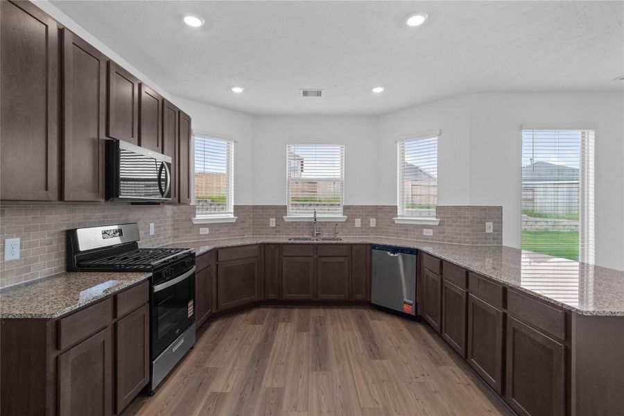 Furnished interior view inside a new home in Oakwood Trails, Tomball (Image 7).