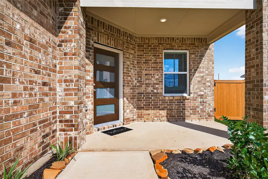 Exterior details and patio area of a home in Sunterra, Katy (Image 3). Exterior details and patio area of a home in Sunterra, Katy (Image 3).