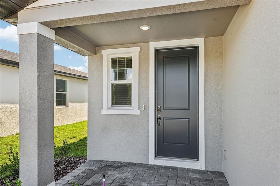 Exterior details and patio area of a home in The Reserve at Hammock Oaks - Classic Series, Lady Lake (Image 4).