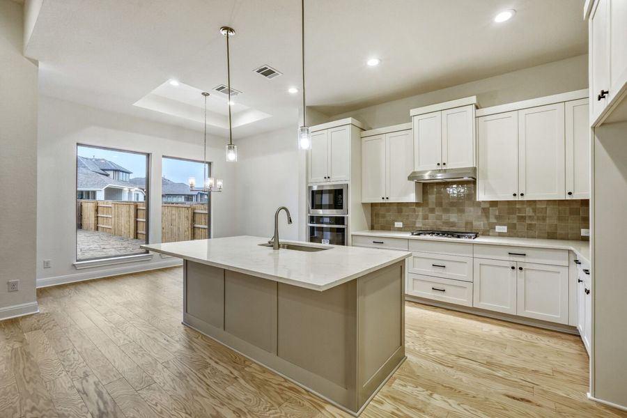 Furnished interior view inside a new home in 6 Creeks, Kyle (Image 3).