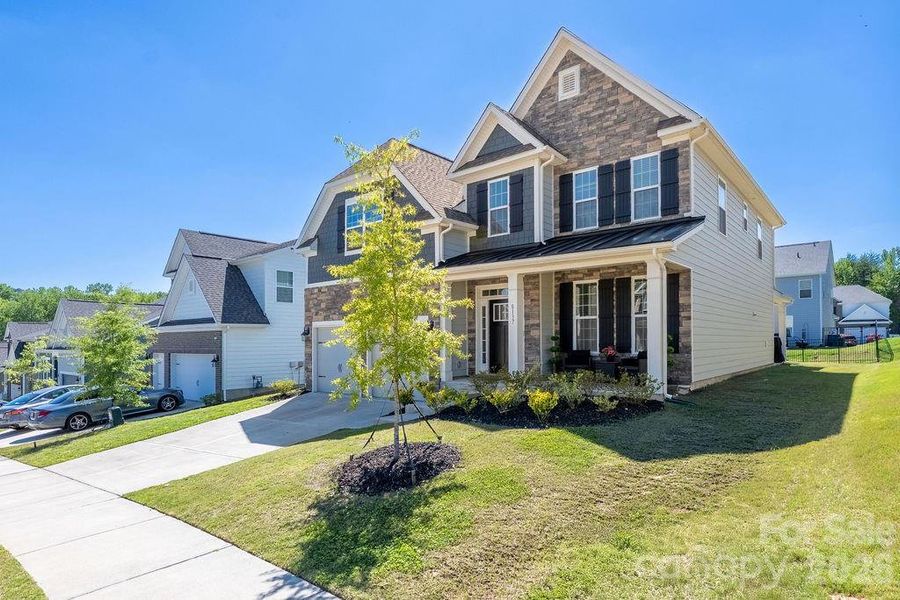 Front exterior of a new home in Sylvan Creek, Denver, NC, highlighting curb appeal (Image 2). Front exterior of a new home in Sylvan Creek, Denver, NC, highlighting curb appeal (Image 2).