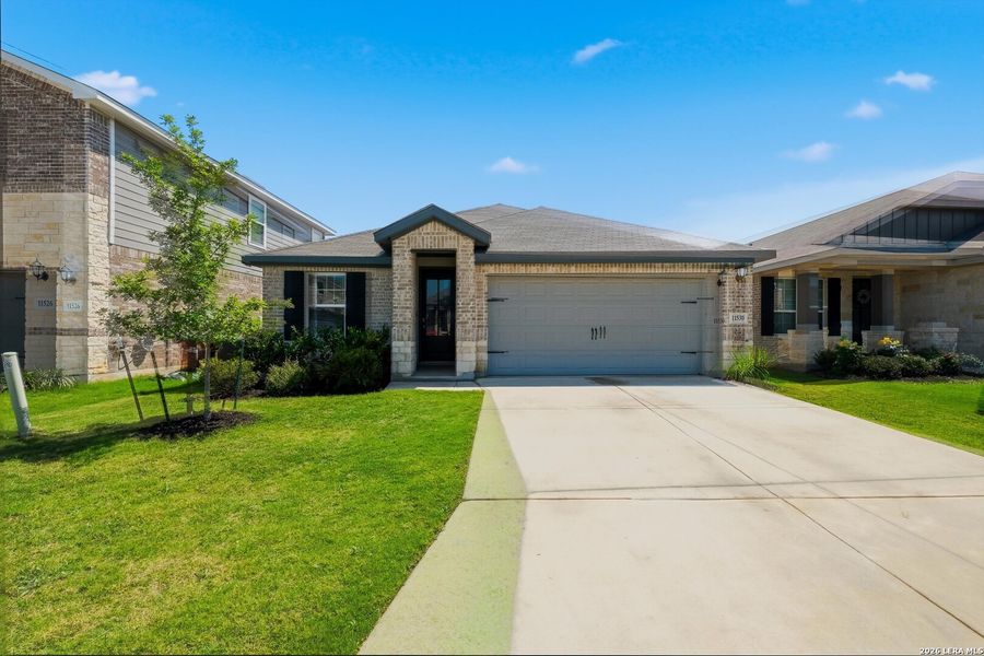 Front exterior of a new home in , San Antonio, TX, highlighting curb appeal (Image 21).