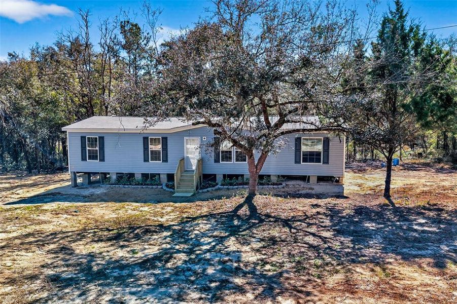 Exterior details and patio area of a home in , Williston (Image 21).