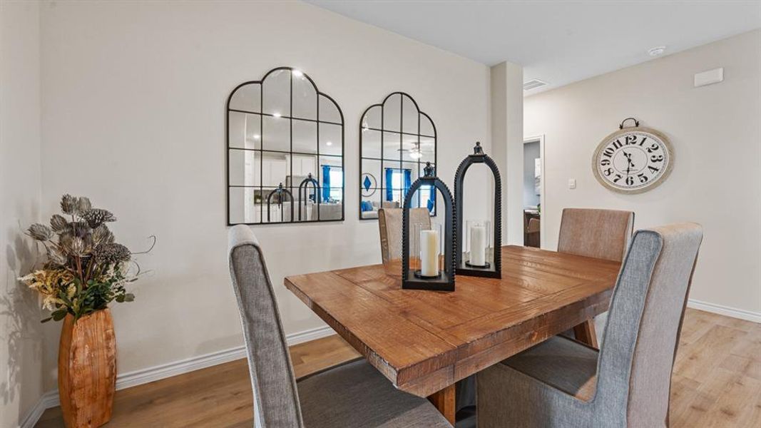 Dining area featuring light wood-style flooring and baseboards Dining area featuring light wood-style flooring and baseboards