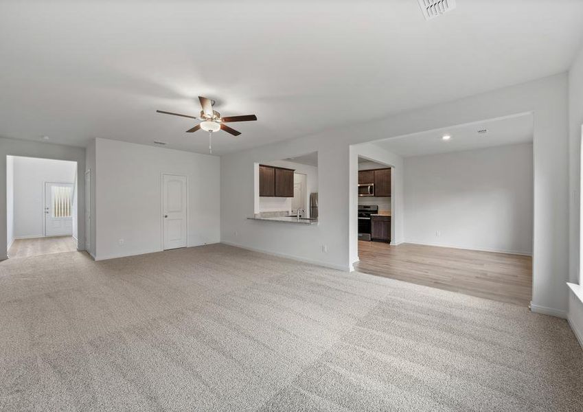 The open layout connects the family room with the kitchen and dining room.