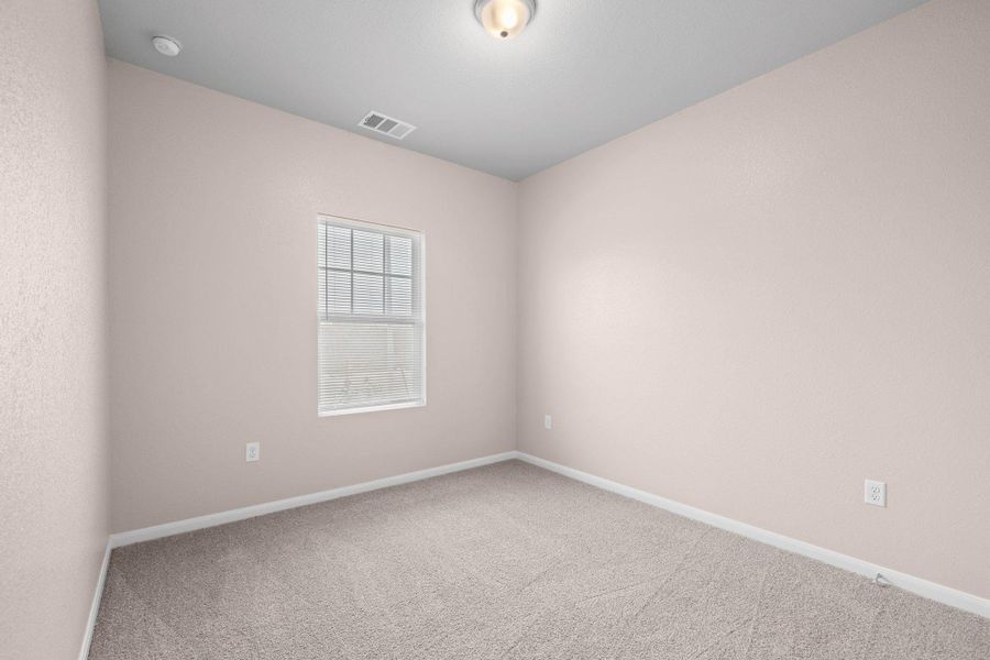 Unfurnished room featuring carpet floors and baseboards