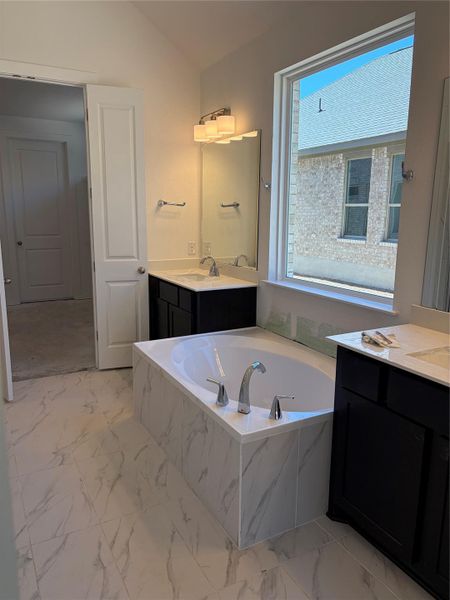Primary Bath with dual vanities and garden tub