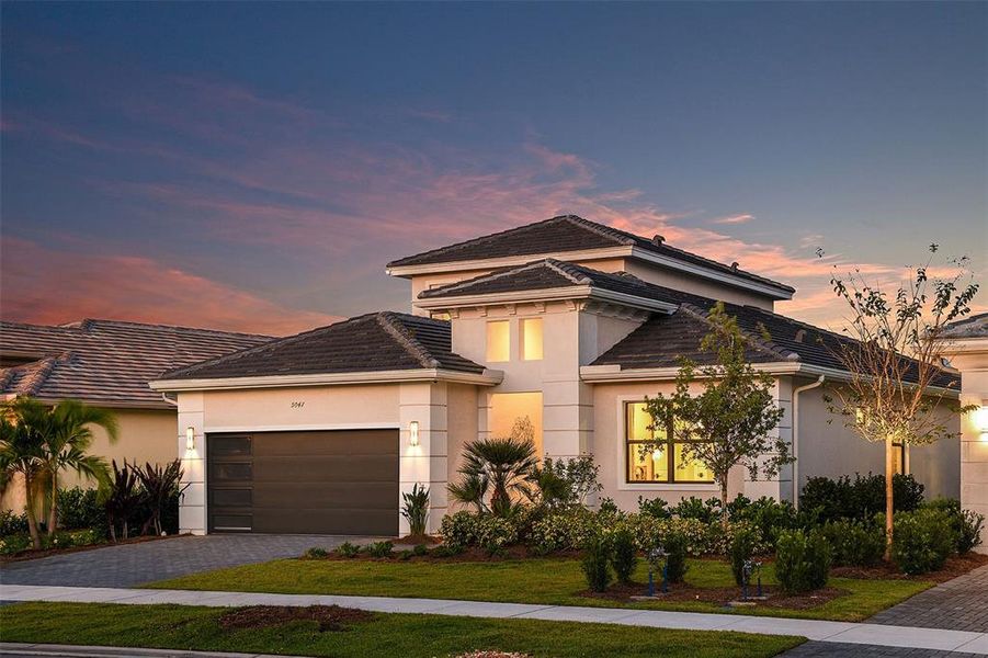 Front exterior of a new home in Cresswind Lakewood Ranch, Lakewood Ranch, FL, highlighting curb appeal (Image 1). Front exterior of a new home in Cresswind Lakewood Ranch, Lakewood Ranch, FL, highlighting curb appeal (Image 1).