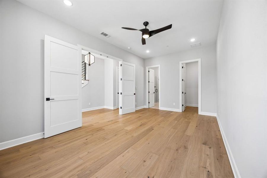 Unfurnished bedroom featuring light wood-style flooring, recessed lighting, and ceiling fan Unfurnished bedroom featuring light wood-style flooring, recessed lighting, and ceiling fan