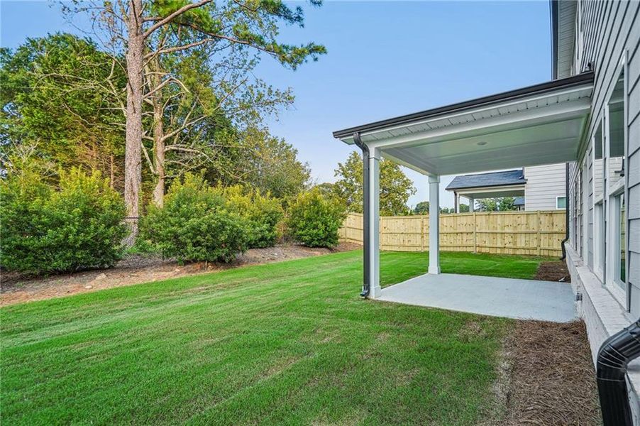Exterior details and patio area of a home in Martin Springs - Estate Series, Lawrenceville (Image 4).