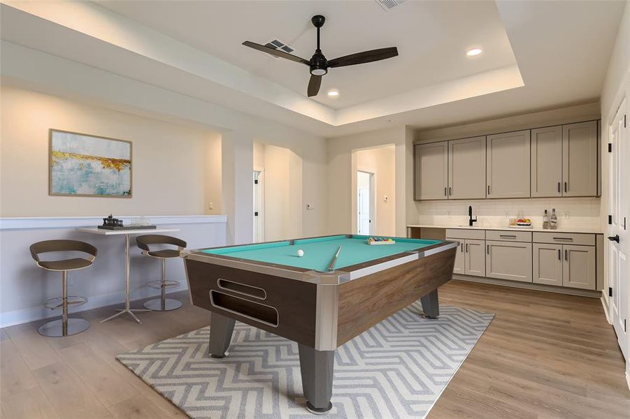 Upstairs game room with wet bar is the perfect second living/relaxing space. (virtual staging)